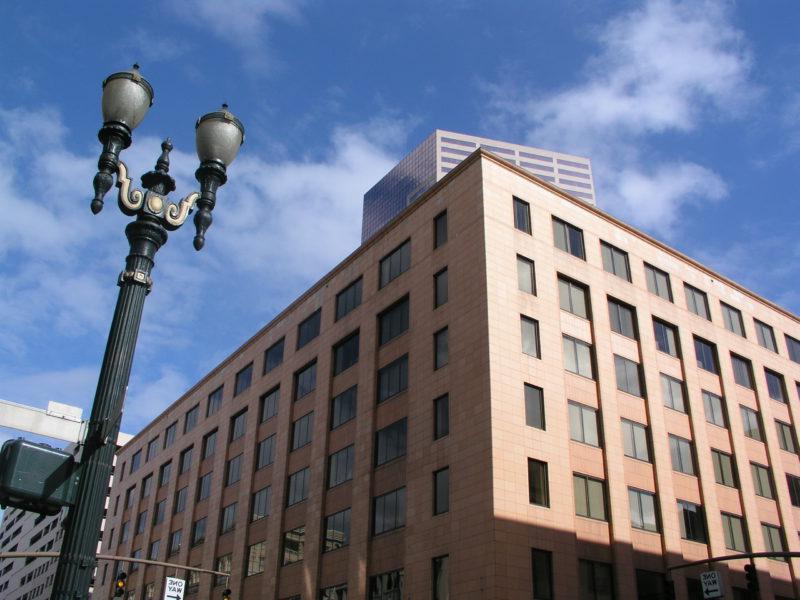 The Lincoln Building, a seven-story office building in downtown Portland, Ore. The US Bancorp Tower is visible behind it.